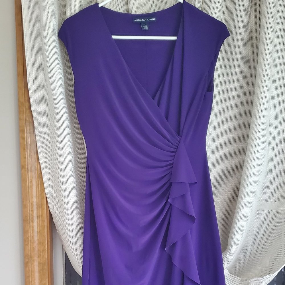 Purple Dress with ruffle detail and sinched waist for a slimming look